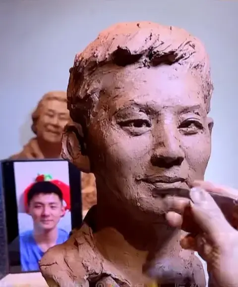 Professional sculptor refining facial expression and lifelike details