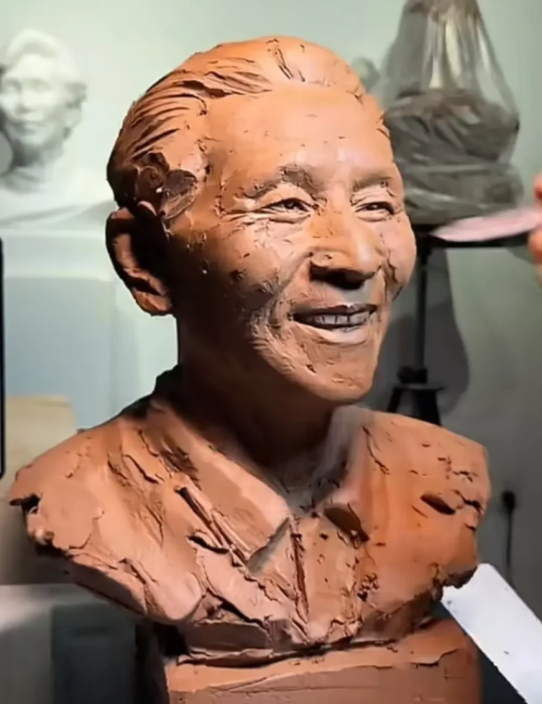 Side view of the custom memorial bronze bust for a smiling elderly man, showcasing the textured hair and lifelike features that reflect his gentle personality.