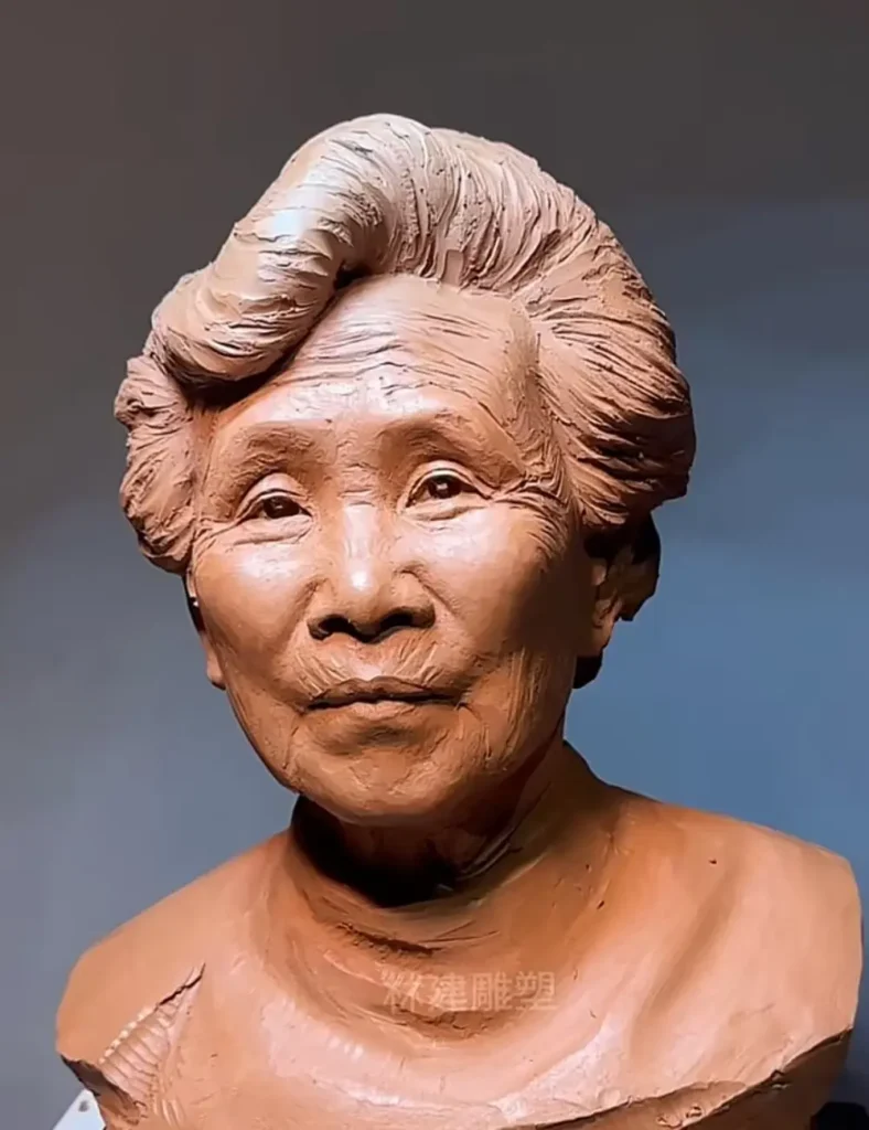 Straight-on front view of the finished custom memorial bronze bust for mother, capturing her gentle gaze and lifelike details