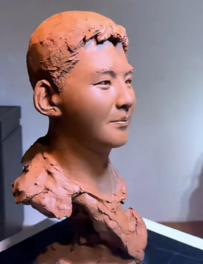 Side view of the custom memorial bronze bust for a young adult, showcasing the textured hair and casual neckline, sculpted to reflect his unique style.